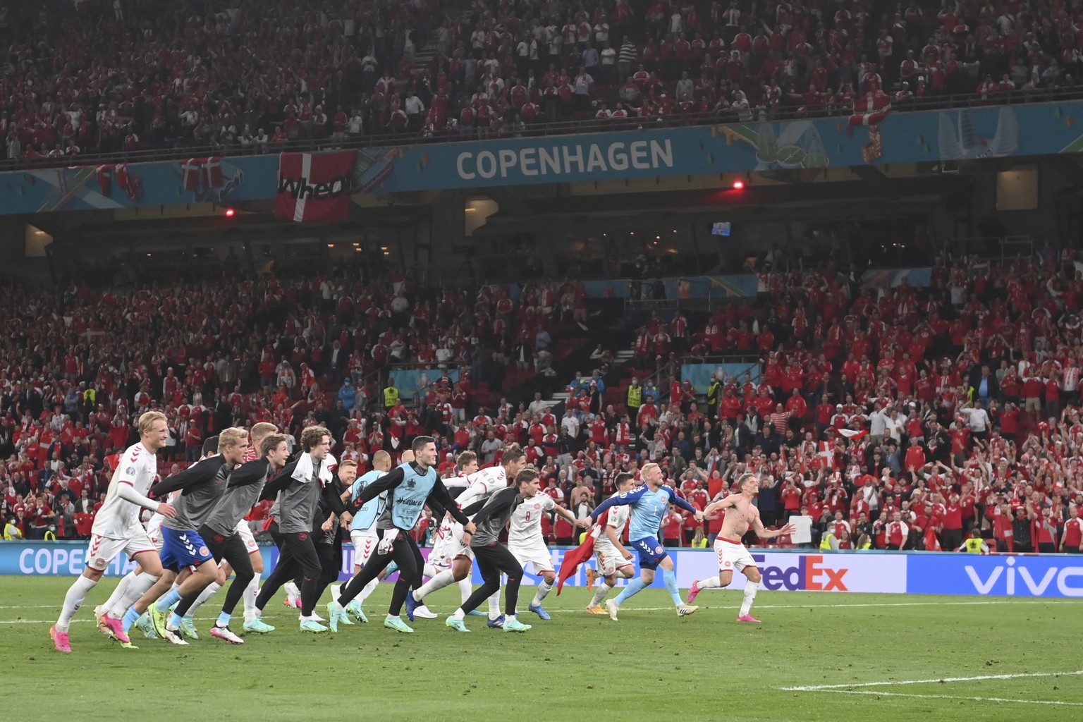 Denmark players celebrate after the Euro 2020 soccer championship group B match between Russia and Denmark at the Parken stadium in Copenhagen, Denmark, Monday, June 21, 2021. Denmark won 4-1. (Stuart ...