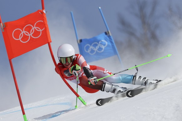 Camille Rast of Switzerland makes a turn during the first run of the women&#039;s giant slalom at the 2022 Winter Olympics, Monday, Feb. 7, 2022, in the Yanqing district of Beijing. (AP Photo/Alessand ...