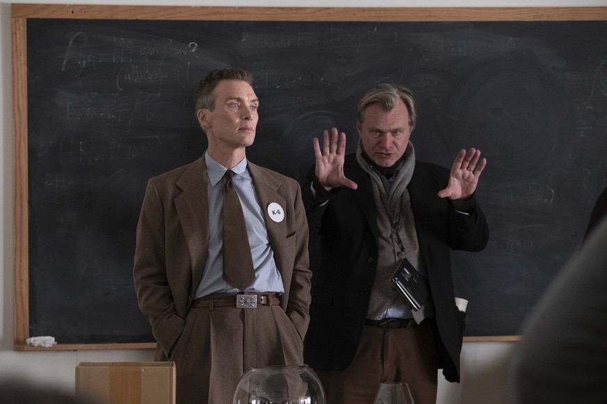 This image released by Universal Pictures shows actor Cillian Murphy, left, and filmmaker Christopher Nolan on the set &quot;Oppenheimer.&quot; (Melinda Sue Gordon/Universal Pictures via AP)