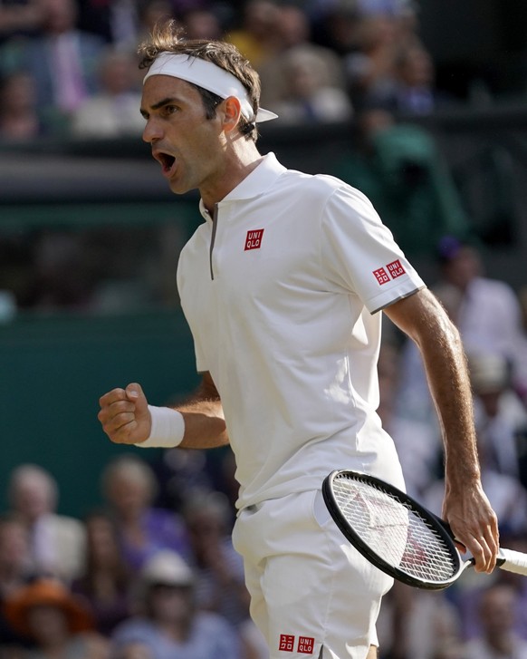 epa07712964 Roger Federer of Switzerland in action against Rafael Nadal of Spain during their semi final match for the Wimbledon Championships at the All England Lawn Tennis Club, in London, Britain,  ...