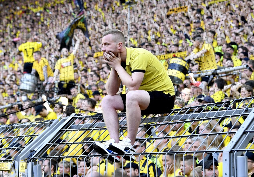 epaselect epa10657919 A dejected fan of Borussia Dortmund after the German Bundesliga match between Borussia Dortmund and Mainz 05 in Dortmund, Germany, 27 May 2023. The match ended 2-2 and both Bayer ...