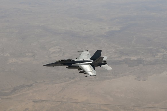 epa06198976 A Royal Australian Air Force (RAAF) F/A-18F Super Hornet is seen after refuelling from a RAAF KC-30A Multi-Role Tanker in the skies over central Iraq during an air operation in the Middle  ...