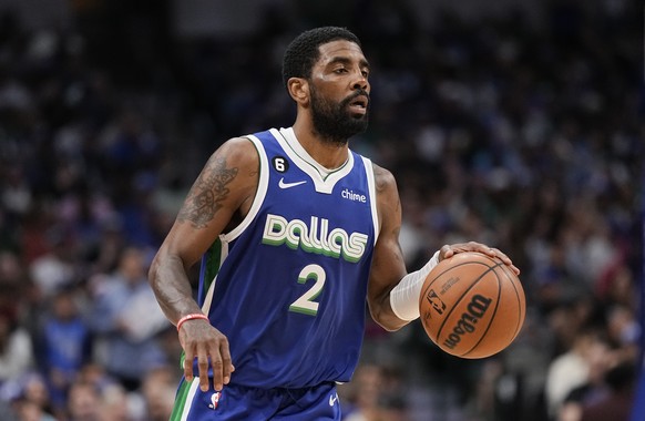 FILE - Dallas Mavericks guard Kyrie Irving (2) brings up the ball during the second half of the team's NBA basketball game against the Sacramento Kings in Dallas, April 5, 2023. Irving agreed to...