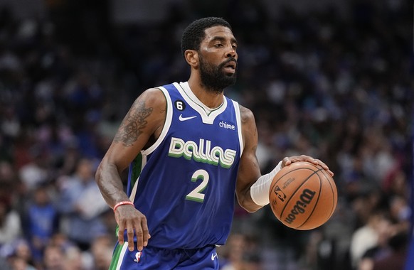 FILE - Dallas Mavericks guard Kyrie Irving (2) brings up the ball during the second half of the team's NBA basketball game against the Sacramento Kings in Dallas, April 5, 2023. Irving agreed to...