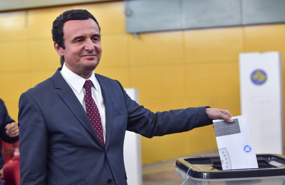 epa07900376 Albin Kurti, parliamentary elections Prime Ministerial candidate and founder of the opposition party Selfdetermination (Vetevendosje) casts his vote during the early parliamentary election ...