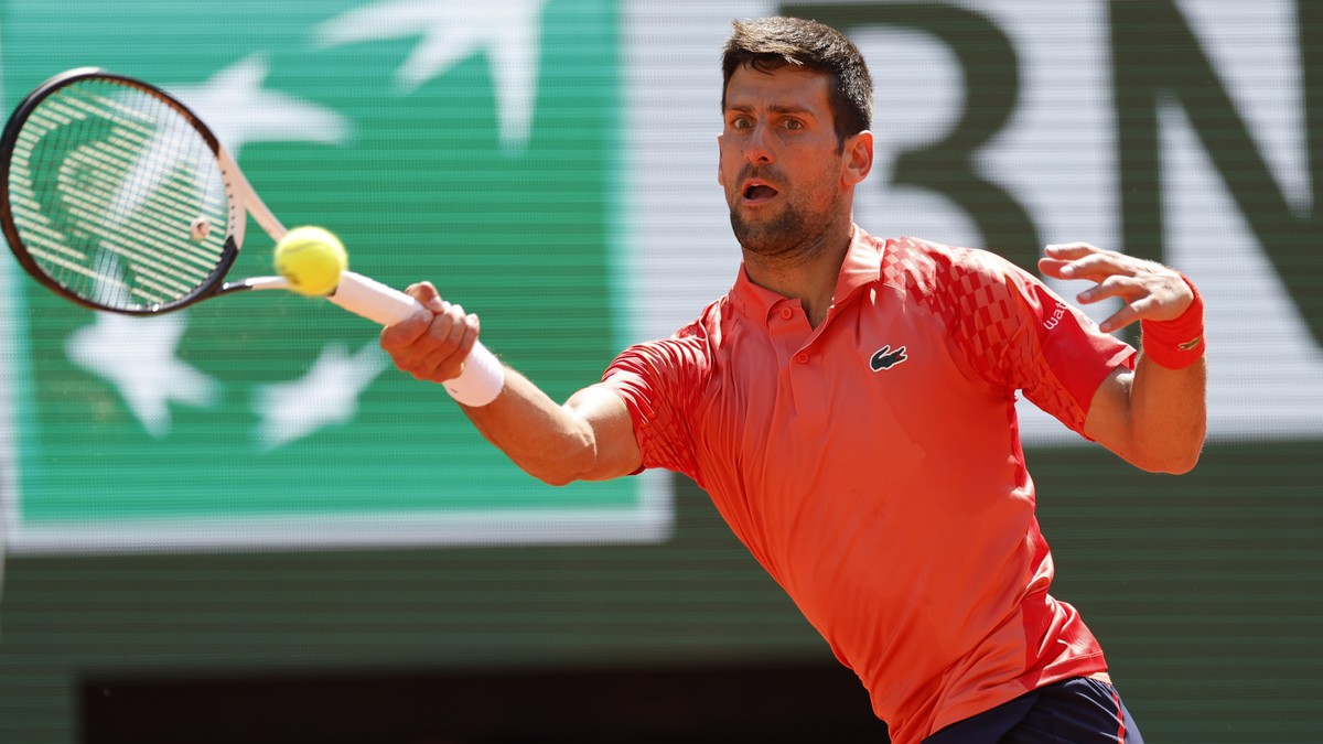 Serbia's Novak Djokovic plays a shot against Aleksandar Kovacevic of the U.S. during their first round match of the French Open tennis tournament at the Roland Garros stadium in Paris, Monday, Ma ...