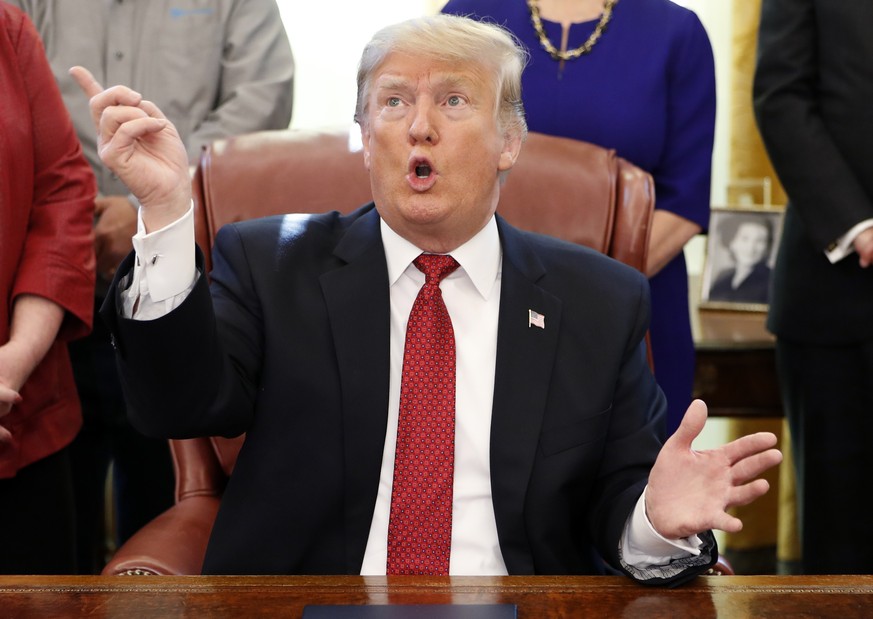 President Donald Trump speaks during a meeting with American manufacturers in the Oval Office of the White House, Thursday, Jan. 31, 2019, in Washington. Trump was signing an executive order pushing t ...