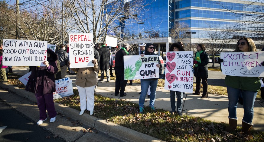 epa05675522 Gun control advocates protest outside the National Rifle Association (NRA) to call for &#039;sensible gun laws&#039; on the fourth anniversary of the Sandy Hook massacre in Fairfax, Virgin ...