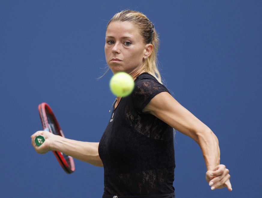 epa10150941 Camila Giorgi of Italy returns the ball to Madison Keys of the United States in their second round match during the US Open Tennis Championships at the USTA National Tennis Center in in Fl ...