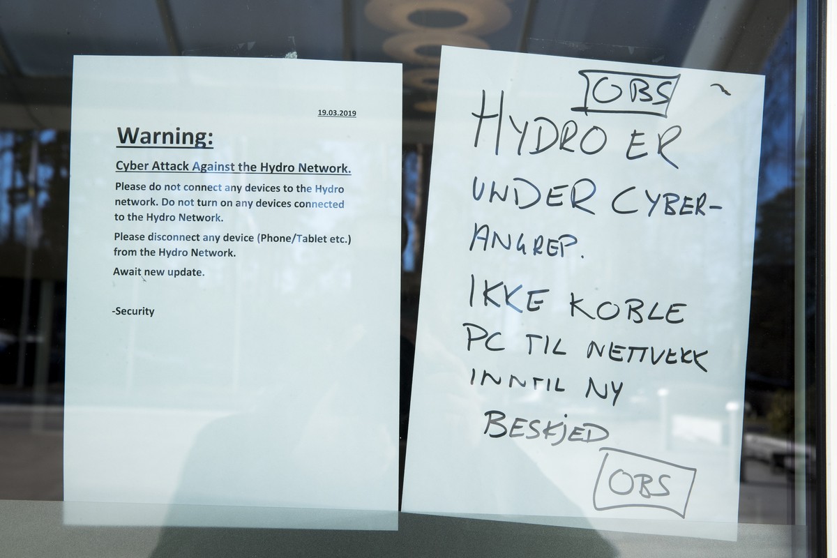 epa07448269 A warning note is pasted at a door of the Norwegian company Hydro in Oslo, Norway, 19 March 2019. The Norwegian company Hydro's global business is exposed to a comprehensive cyber att ...