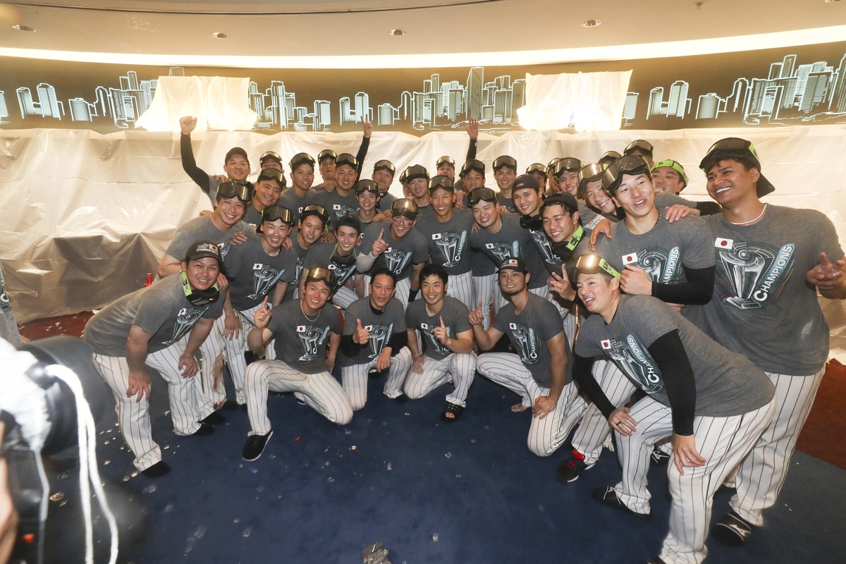 Japan players celebrate in the clubhouse after defeating the United States in the World Baseball Classic championship game, Wednesday, March 22, 2023, in Miami. (Alex Trautwig/Pool Photo via AP)