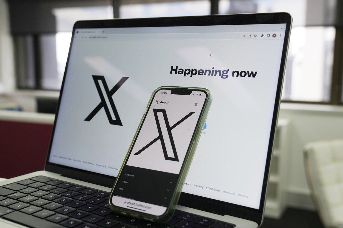 FILE - The opening page of X is displayed on a computer and phone, Oct. 16, 2023, in Sydney. The social media platform X says it will now allow people to show consensual adult content, as long as it i ...