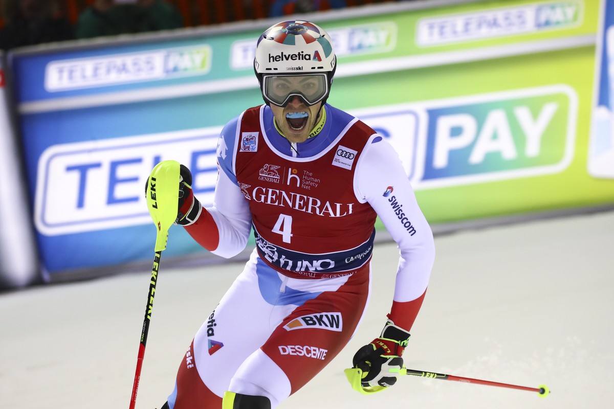 Switzerland's Daniel Yule celebrates after winning an alpine ski, men's World Cup slalom in Madonna di Campiglio, Italy, Wednesday, Jan. 8, 2020.(AP Photo/Alessandro Trovati)