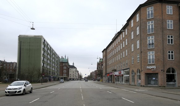 Oesterbrogade, a normally busy Copenhagen boulevard with lots of traffic is seen empty on Wednesday March 18, 2020. As of Wednesday, Denmark has banned the gathering of 10 or more people in the public ...