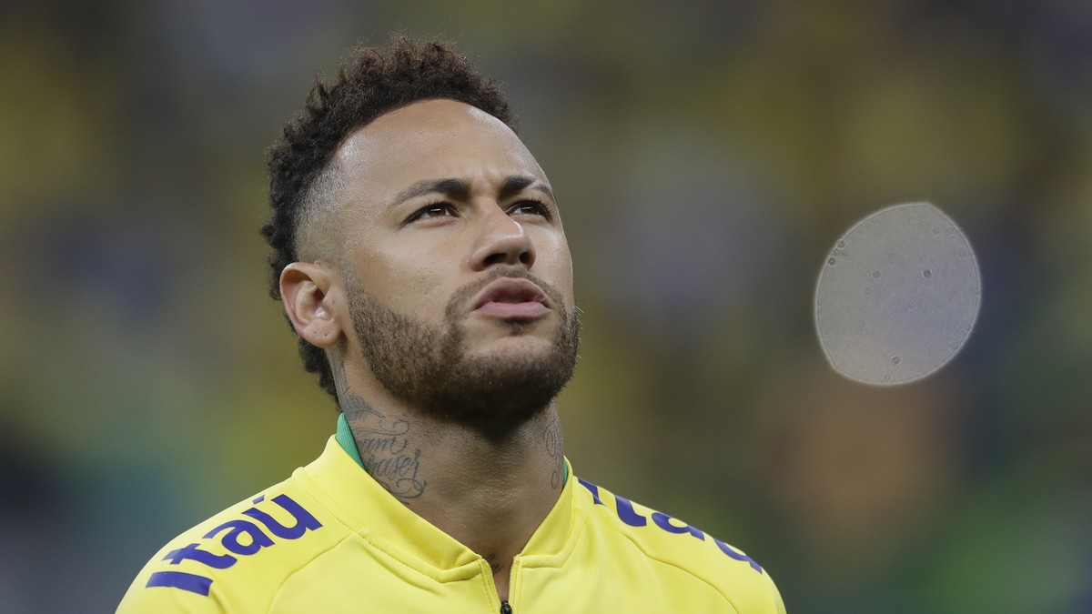 Brazil's Neymar sings the national anthem prior a friendly soccer match against Qatar at the Estadio Nacional in Brasilia, Brazil, Wednesday, June 5, 2019.(AP Photo/Andre Penner)