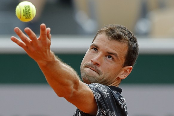 Bulgaria&#039;s Grigor Dimitrov serves against Croatia&#039;s Marin Cilic during their second round match of the French Open tennis tournament at the Roland Garros stadium in Paris, Wednesday, May 29, ...