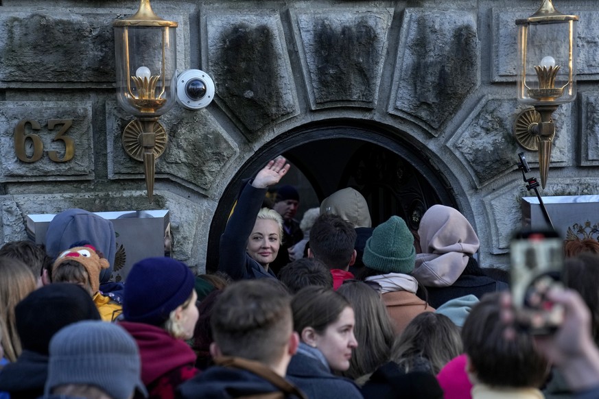 Yulia Navalnaya, centre, widow of Alexey Navalny, waves as she enters the Russian Embassy with other voters at a polling station in the Russian embassy in Berlin, after noon local time, on Sunday, Mar ...