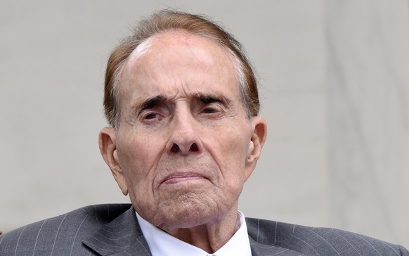 epa09624315 (FILE) Former Senator Bob Dole attends a wreath-laying ceremony at the Tomb of the Unknown Soldier at Arlington National Cemetery on Memorial Day, in Arlington, Virginia, USA, 29 May 2017  ...