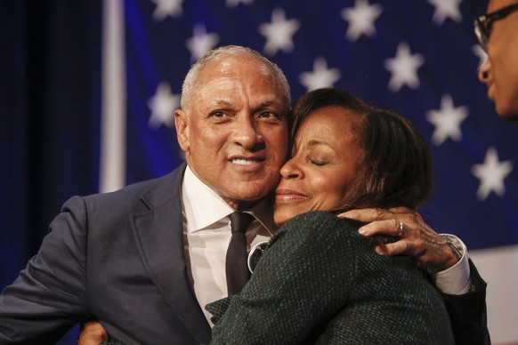 Democrat Mike Espy who sought to unseat appointed U.S. Sen. Cindy Hyde-Smith, R-Miss., and serve the last two years of the six-year term vacated when Republican Thad Cochran retired gets a hug from hi ...