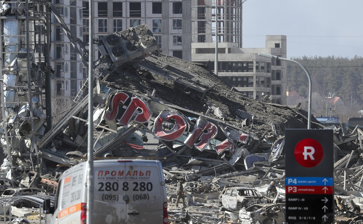 epa09840441 A general view of the damaged shopping center that was targeted by a Russian attack in Kyiv, Ukraine, 21 March 2022. According to the emergency service in Kyiv (Kiev), at least six people  ...