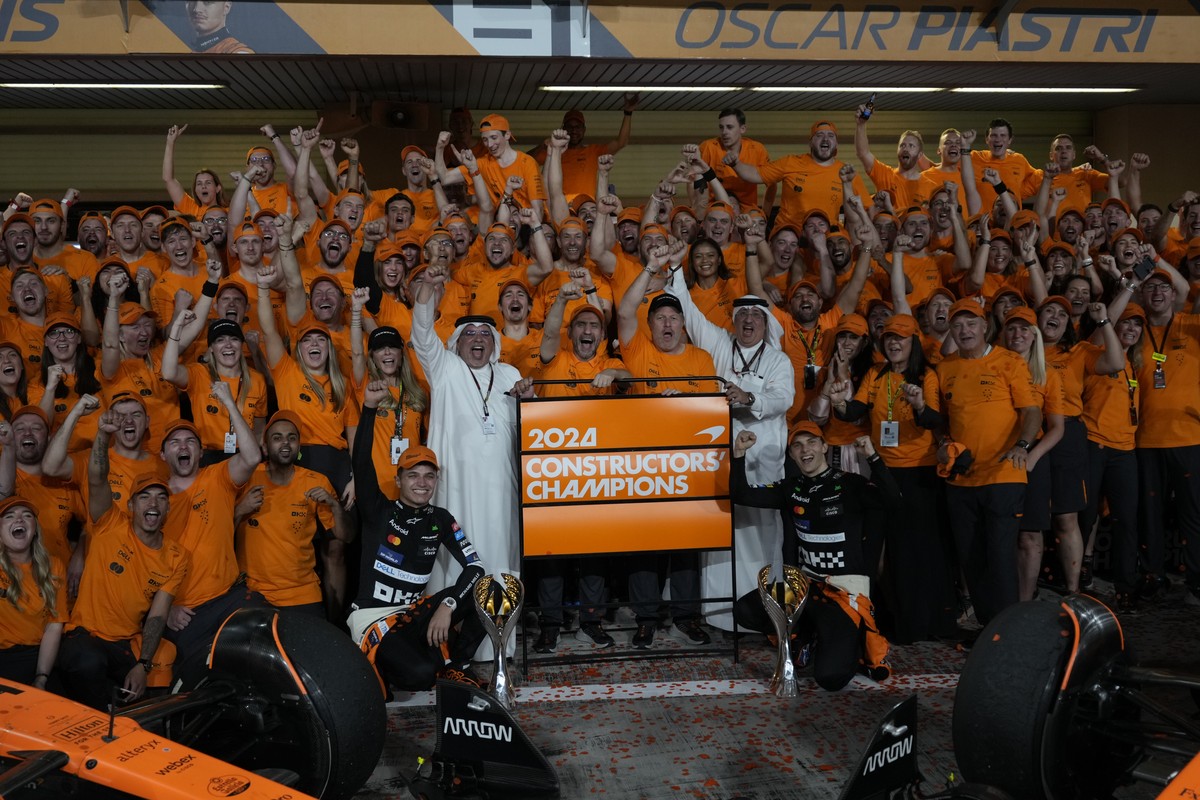 Mclaren team members celebrate winning the constructors championship after the Formula One Abu Dhabi Grand Prix at the Yas Marina Circuit in Abu Dhabi, UAE, Sunday, Dec. 8, 2024. (AP Photo/Altaf Qadri ...