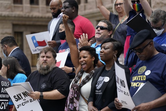 Demonstrators protest proposed voting bill on the steps of the Texas Capitol, Tuesday, July 13, 2021, in Austin, Texas. Texas Democrats left the state to block sweeping new election laws, while Republ ...