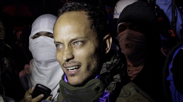 epa06443980 (FILE) - Oscar Perez, agent of the Investigation, Scientific, Criminal and Criminal Investigation Unit (CICPC), while participating in a night march in Caracas, Venezuela, 13 July 2017 (is ...