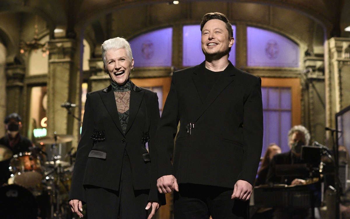 This image released by NBC shows host Elon Musk with his mother Maye as he delivers his opening monologue on "Saturday Night Live" in New York on May 8, 2021. (Will Heath/NBC via AP)