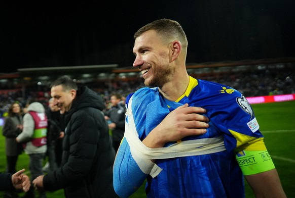 epa12863034 Edin Dzeko of Bosnia and Herzegovina celebrates after the team won the penalty shoout-out in the FIFA World Cup 2026 European playoff match between Bosnia and Herzegovina and Italy in Zeni ...