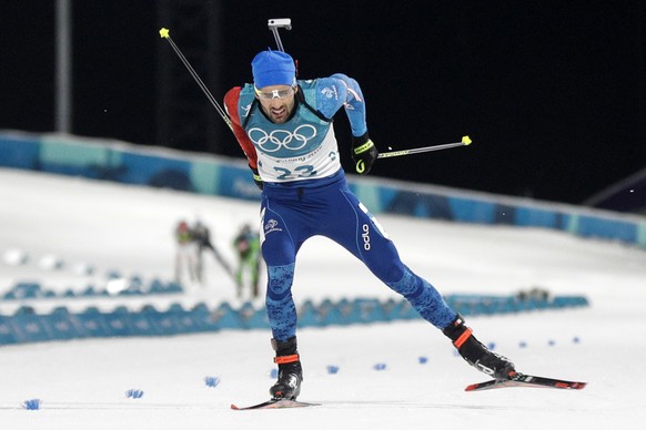 Martin Fourcade, of France, skis across the finish line during the men&#039;s 20-kilometer individual biathlon at the 2018 Winter Olympics in Pyeongchang, South Korea, Thursday, Feb. 15, 2018. (AP Pho ...