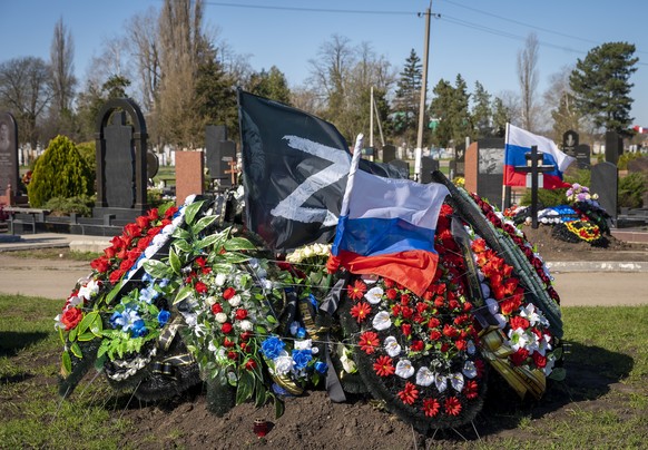 FILE - A grave of a Russian serviceman who died during the Russian-Ukrainian war at the cemetery in the village of Dinskaya, Krasnodar region, southern Russia, on Saturday, April 1, 2023. Nearly 50,00 ...