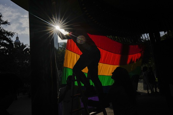 Members of LGBTQ+ organizations take part in an event marking 50 years after what turned out to be the first Pride demonstration in Chile, in Santiago, Saturday, April 22, 2023. (AP Photo/Esteban Feli ...