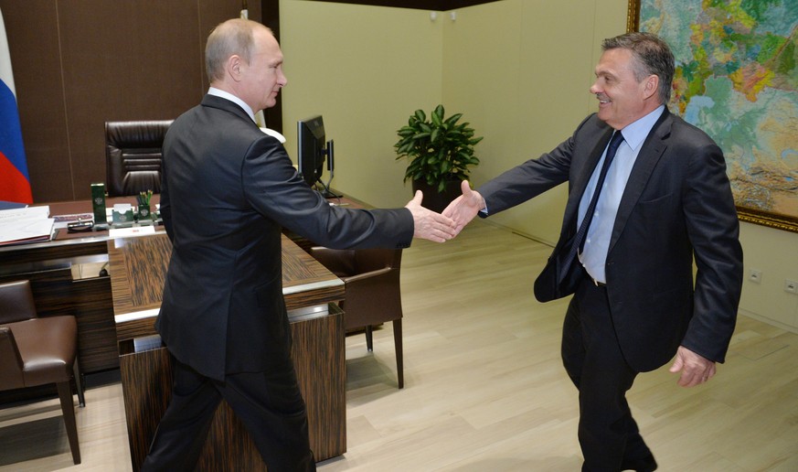 Russian President Vladimir Putin, left, shakes hands with International Ice Hockey Federation President Rene Fasel in the Bocharov Ruchei residence in Sochi, Russia, Friday, Nov. 28, 2014. (AP Photo/R ...