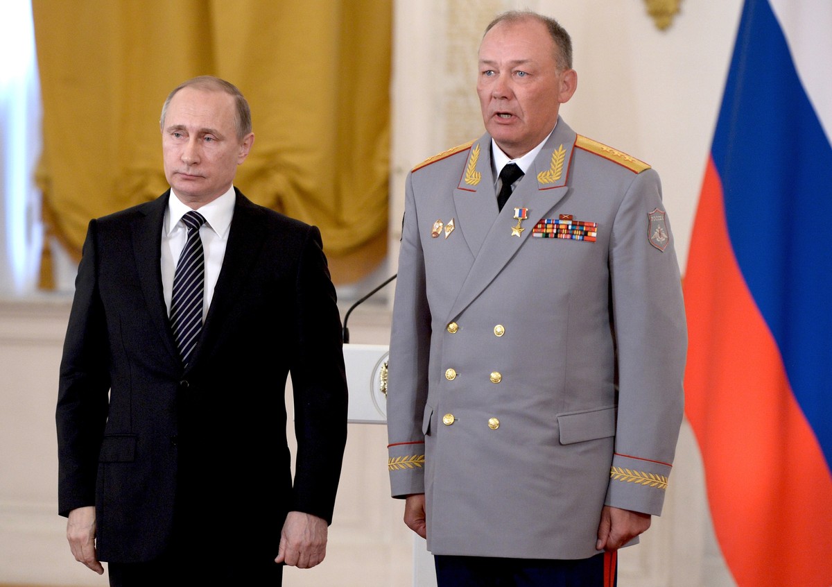 In this photo taken on March 17, 2016, Russian President Vladimir Putin, left, poses with Col. Gen. Alexander Dvornikov during an awarding ceremony in Moscow's Kremlin, Russia. Russia has appoint ...