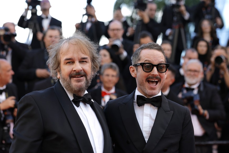 epa12950809 Peter Jackson (L) and Elijah Wood arrive for the premiere of 'The Electric Kiss' (La Venus Electrique) and the opening ceremony of the 79th annual Cannes Film Festival, in Cannes ...