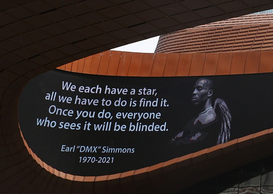 epa09157680 The marquee of the Barclays Center displays a picture of US rapper DMX during a private memorial in Brooklyn, New York, USA, 24 April 2021. DMX died at the age of 50, after he was admitted ...