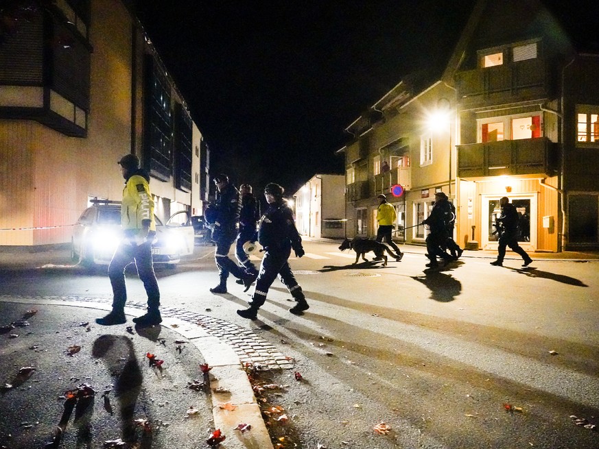 Police walk at the scene after an attack in Kongsberg, Norway, Wednesday, Oct. 13, 2021. Several people have been killed and others injured by a man armed with a bow and arrow in a town west of the No ...