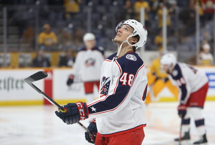 NASHVILLE, TN - FEBRUARY 22: Columbus Blue Jackets left wing Calvin Thurkauf (48) juggles the puck prior to the NHL, Eishockey Herren, USA game between the Nashville Predators and Columbus Blue Jacket ...