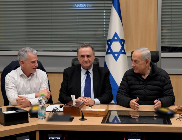 epa12788014 A handout photo made available by Israel's Government Press Office (GPO) shows Israeli Prime Minister Benjamin Netanyahu (2-R) during an emergency security assessment with Defense Min ...