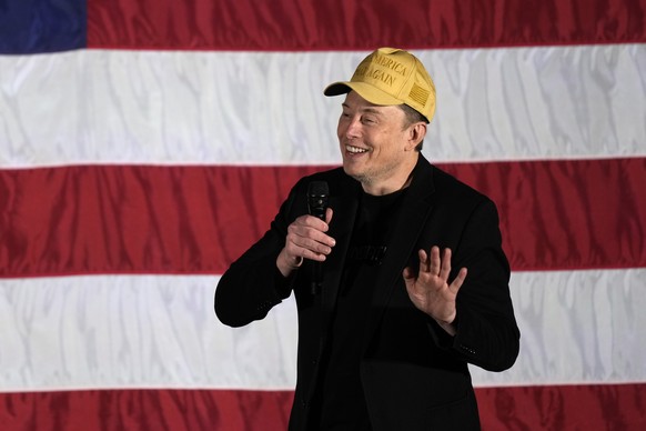 Elon Musk speaks as part of a campaign town hall in support of Republican presidential nominee former President Donald Trump in Folsom, Pa., Thursday, Oct. 17, 2024. (AP Photo/Matt Rourke)