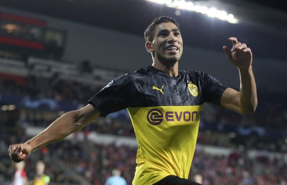 epa07890144 Achraf Hakimi of Borussia Dortmund celebrates after scoring the 2-0 lead during the UEFA Champions League Group F match between Slavia Prague and Borussia Dortmund in Prague, Czech Republi ...