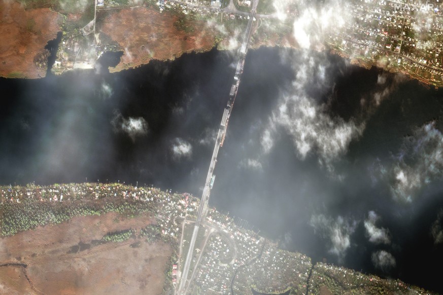 This satellite image from Friday shows the Antonovsky Road Bridge in Kherson, which has blown up in several places, and the pontoon bridge running parallel to it, which is also damaged.