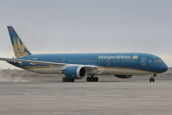 epa11717356 The President of Vietnam, Luong Cuong, arrives aboard a Vietnam Airlines plane at the Callao Air Base for an official visit to the country and to participate in the Asia-Pacific Economic C ...