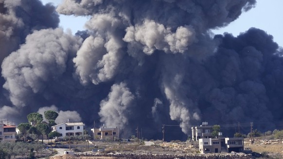 Black smoke rises from an Israeli airstrike on the outskirts of Aita al-Shaab, a Lebanese border village with Israel in south Lebanon, Saturday, Nov. 4, 2023. The Lebanon-Israel border has been the si ...