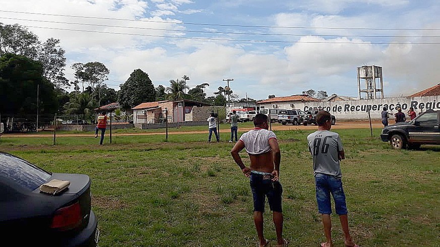 epa07747881 A handout picture provided by XINGU 230 shows a group of journalist and curious people waiting outside of a prison in Altamira, state of Para, Brazil, 29 July 2019. At least 52 prisoners d ...