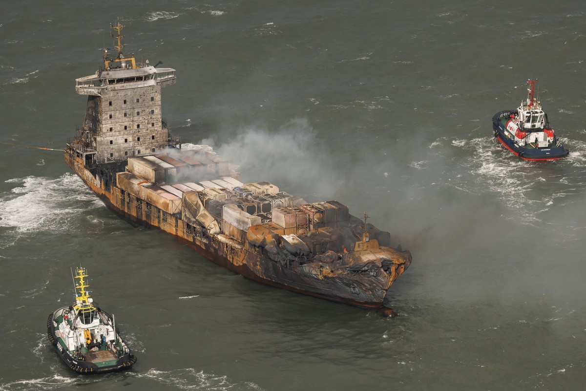 epa11956642 An aerial view as smoke billows from the MV Solong cargo ship in the North Sea, off the Yorkshire coast , Britain, 11 March 2025. Thirty-six people were reportedly brought ashore, and one  ...