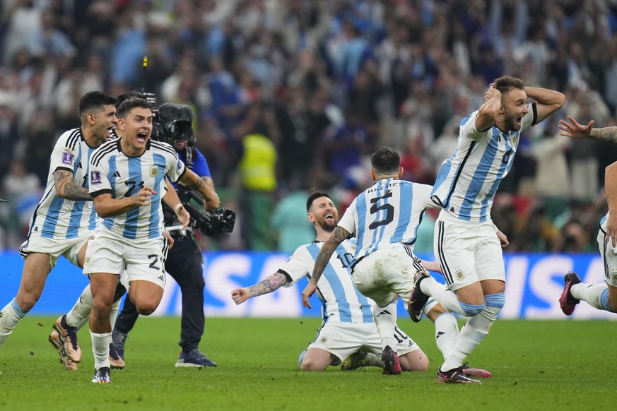 Argentinian players celebrate after winning penalty shootout during the World Cup final soccer match between Argentina and France at the Lusail Stadium in Lusail, Qatar, Sunday, Dec. 18, 2022. (AP Pho ...