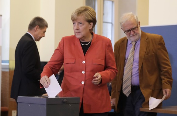 German Chancellor Angela Merkel casts her vote in Berlin, Germany, Sunday, Sept. 24, 2017. Merkel is widely expected to win a fourth term in office as Germans go to the polls to elect a new parliament ...