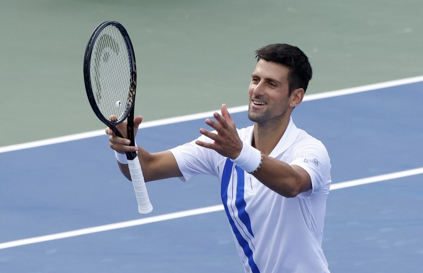 epa08627618 Novak Djokovic of Serbia celebrates defeating Jan-Lennard Struff of Germany during their quarter-finals match at the Western and Southern Open at the USTA National Tennis Center in Flushin ...