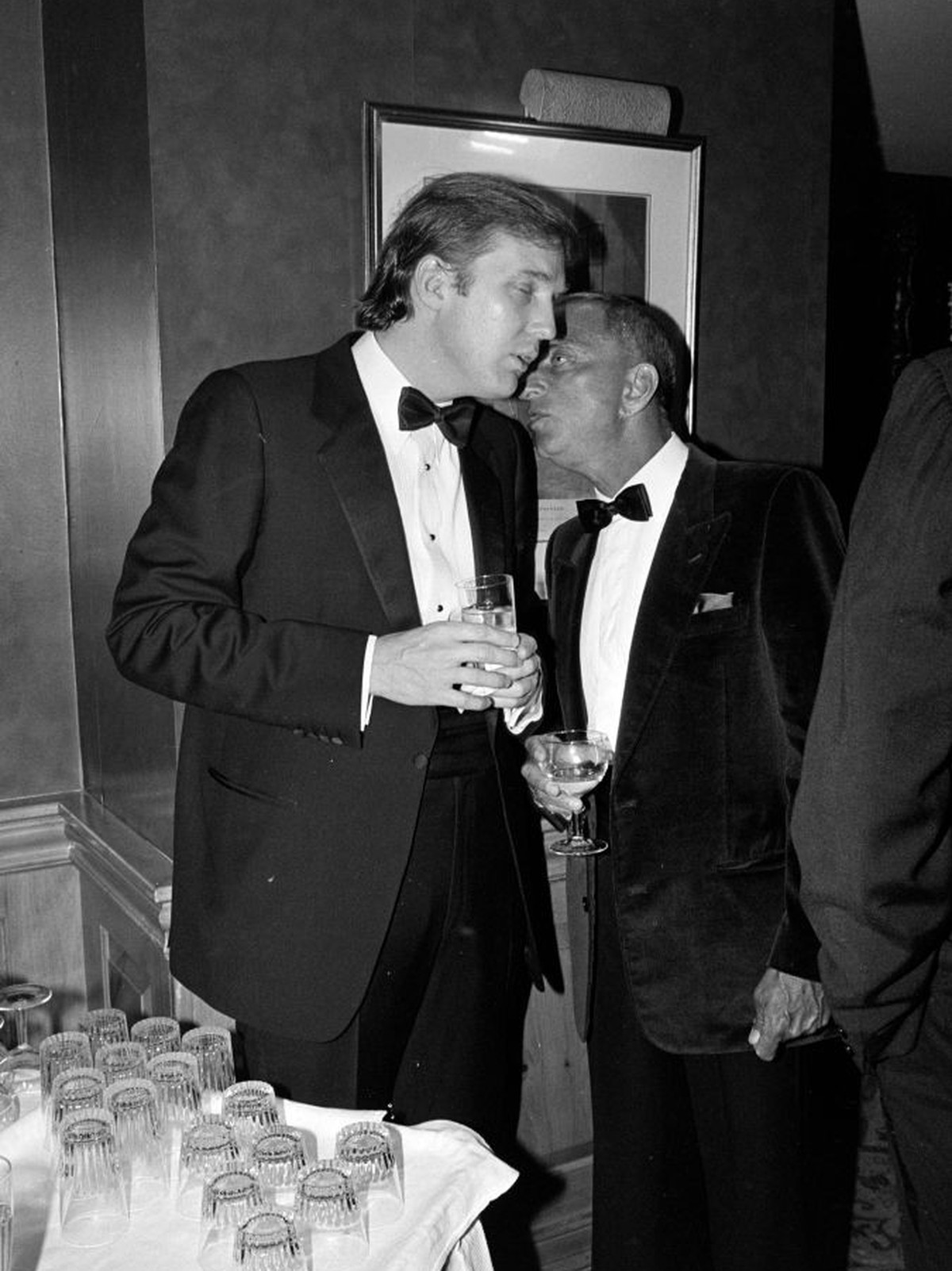 Donald J. Trump (L) and Roy Cohn attend a party at the Ritz-Carlton Hotel in Washington, D.C., on March 20, 1983. (Photo by Guy DeLort/WWD/Penske Media via Getty Images)